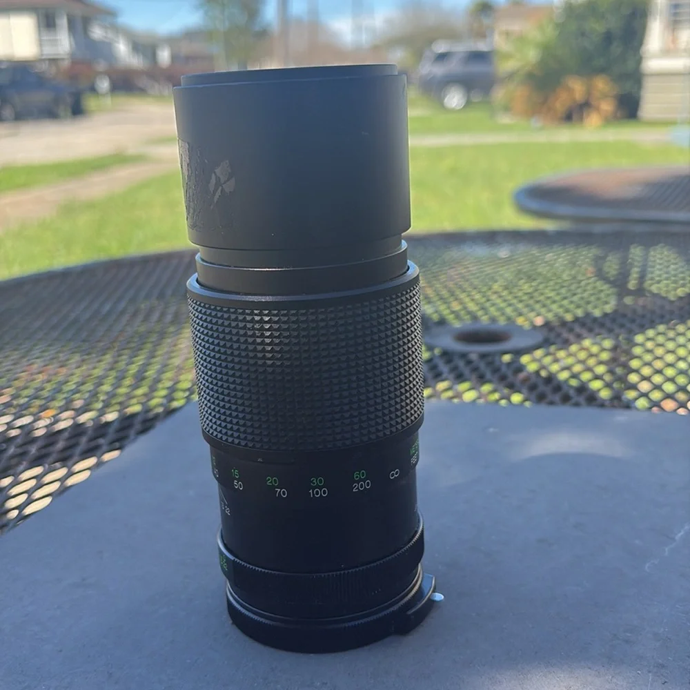 The image shows a Vivitar 300mm 1:5.6 lens. Additional information: